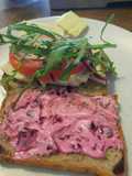 Poached chicken sandwich with garlic and beet mayo