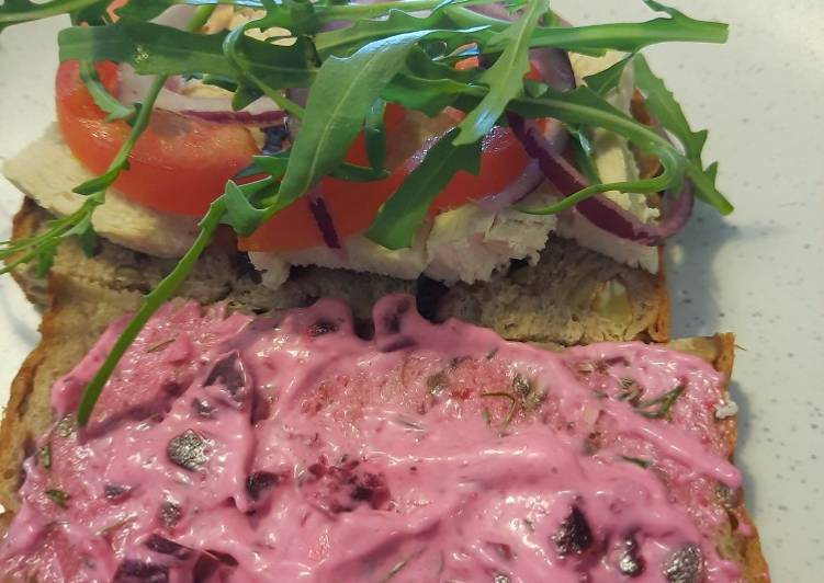 Poached chicken sandwich with garlic and beet mayo