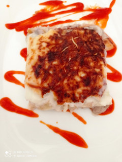 Una foto de Canelones rossini