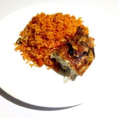 A picture of Hot Jollof Rice and Chicken.