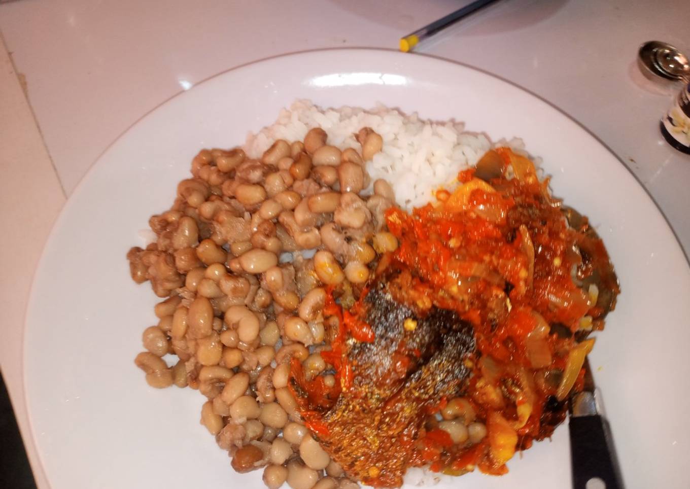 White rice and beans with fish stew