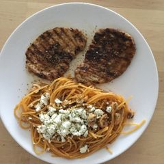 A picture of Small steaks with pasta.