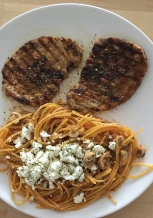 A picture of Small steaks with pasta.
