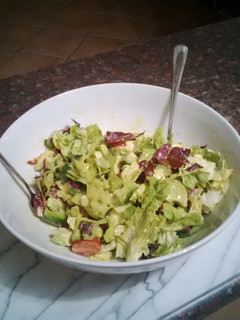 A picture of Bornmann's Vegan Green Salad with Tahini Dressing.