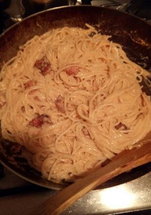 A picture of Spaghetti with Bacon in Cheese and Tomato Sauce.
