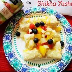 A picture of Tropical Fruit Enchilada wrapped in Mango Coconut Chutney & Pineapple glaze.