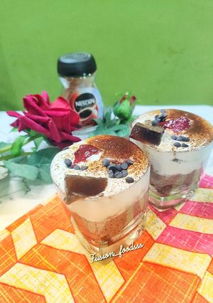 A picture of Coffee chocolate mousse with whipped cream.