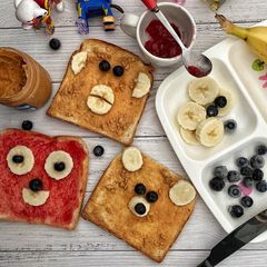 A picture of Peanut butter and strawberry jam breakfast.