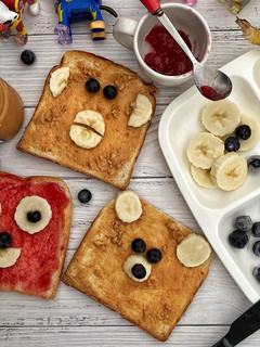 A picture of Peanut butter and strawberry jam breakfast.