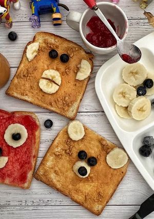A picture of Peanut butter and strawberry jam breakfast.
