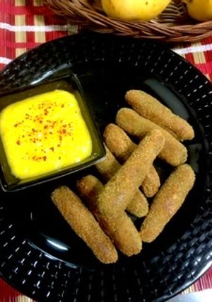 A picture of Mango flavoured Chicken fingers with mango dip.