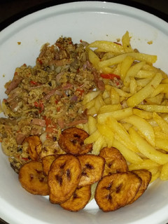 A picture of Irish plantain and egg sauce with sausage.