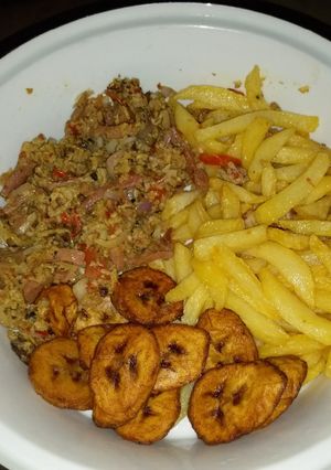 A picture of Irish plantain and egg sauce with sausage.