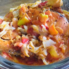 A picture of Salmon with tomato cheese.