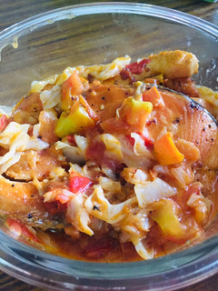 A picture of Salmon with tomato cheese.