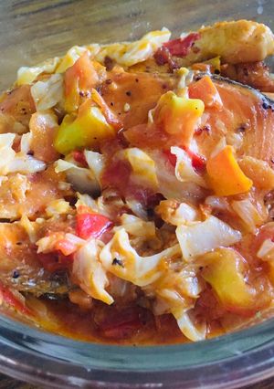 A picture of Salmon with tomato cheese.