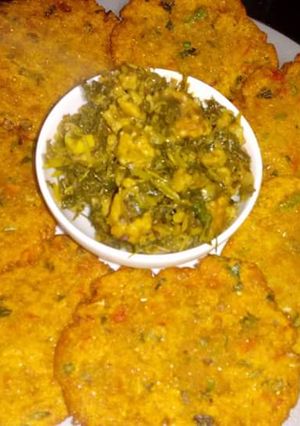 A picture of Methi magodi sabji with methi makka veg puri.