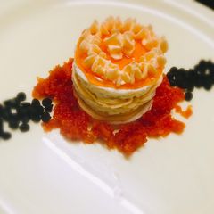 Steamed layered sandesh with orange mousse A picture of Steamed layered sandesh with orange mousse.