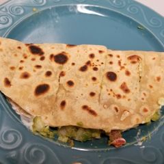 A picture of Mexican avocado cheese taco.