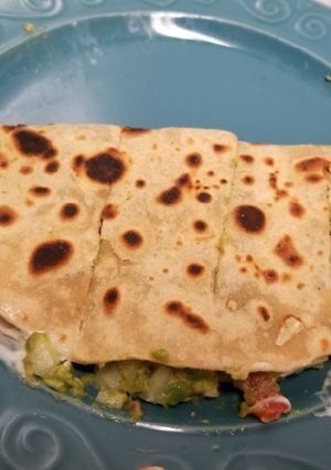 A picture of Mexican avocado cheese taco.
