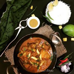 A picture of Aam Kasundi Mangsho (Mutton in Raw Mango-Mustard Gravy).