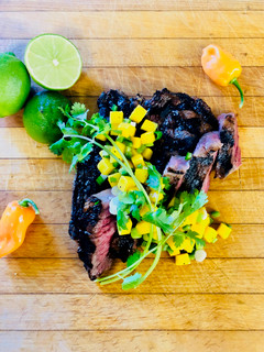 A picture of Jerk Marinated Fullblood Wagyu Chuck Eye Steak with Mango Relish.