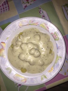 Una foto de Ñoquis con salsa de quesos
