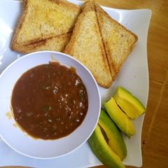 Oxtail soup and Bread A picture of Oxtail soup and Bread.