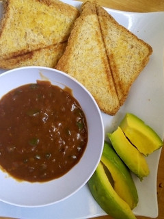 A picture of Oxtail soup and Bread.