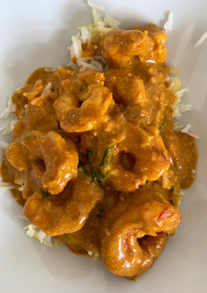Una foto de Curry de langostinos