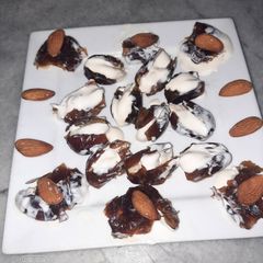 A picture of Dates with fresh cream almond.