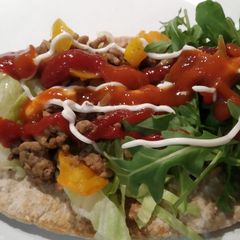 A picture of Pitta bread with minced lamb.