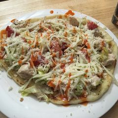A picture of Grilled Chicken Bacon Ranch salad pizza.