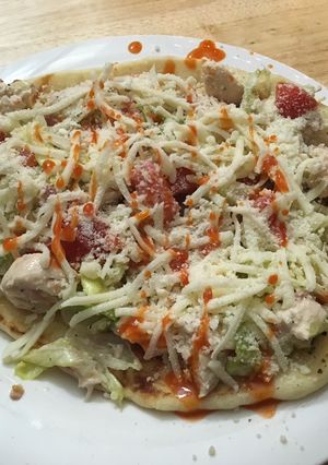 A picture of Grilled Chicken Bacon Ranch salad pizza.