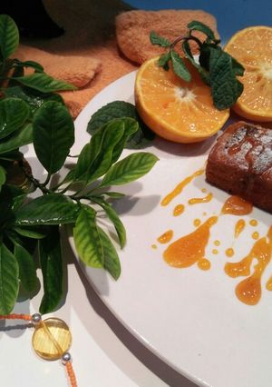 A picture of Orange cake with orange sauce.