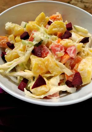A picture of Potato salad with beetroot.