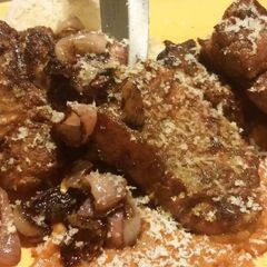 A picture of Smoked Lamb Chops Ras el hanout, topped with Garda Stagionato.