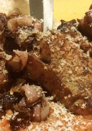A picture of Smoked Lamb Chops Ras el hanout, topped with Garda Stagionato.