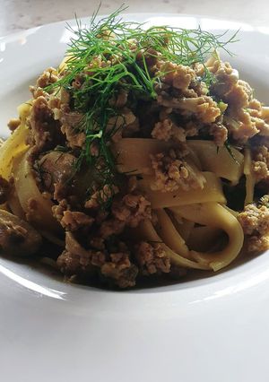 A picture of Tagliatelle with White Ragù, Mushrooms, Fennel Greens, and Saffron.