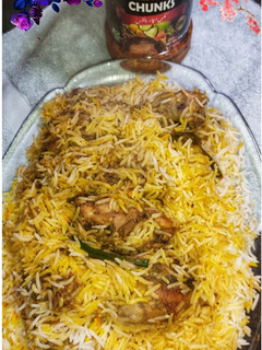 A picture of Achari Chicken Biryani.