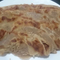 A picture of Soft layered brown chapatis.