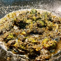 A picture of Gota Kalara Besara Bhaja (Small Bitter Gourd stuffed with Mustard paste).