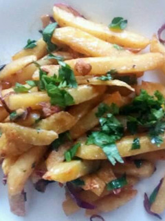 A picture of Spicy buttered chips.