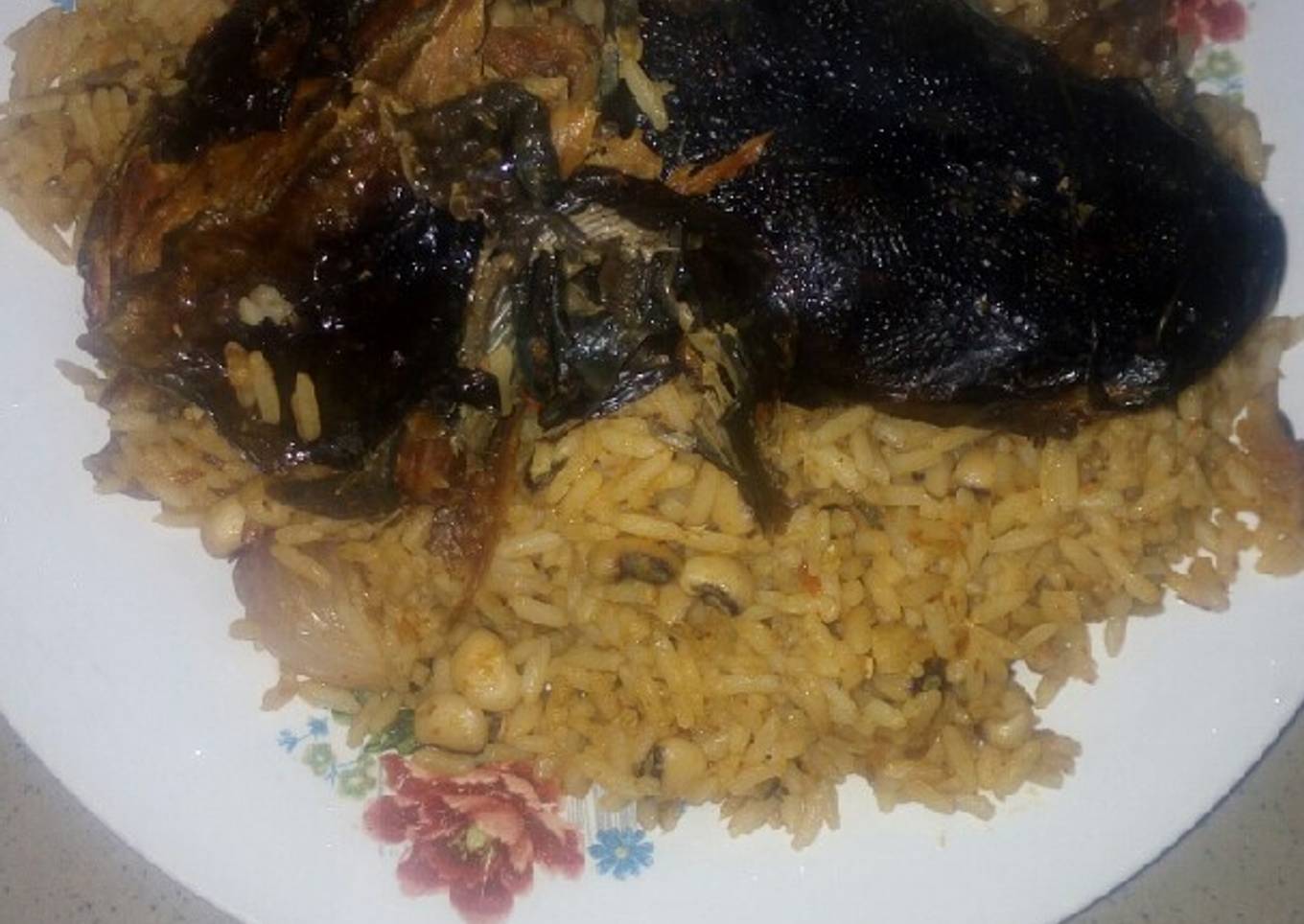 Jollof rice and beans with dry Fish