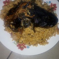 Jollof rice and beans with dry Fish A picture of Jollof rice and beans with dry Fish.