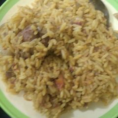 A picture of Jollof rice and meat.