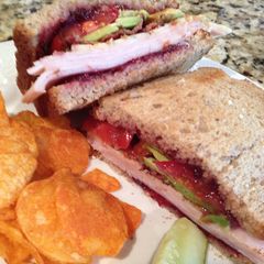 A picture of Turkey, Bacon, Cranberry, Avocado Sandwich.
