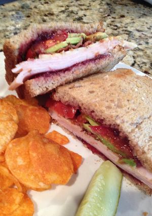 A picture of Turkey, Bacon, Cranberry, Avocado Sandwich.