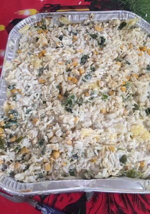 Una foto de Soufflé de arroz con pollo, chile poblano, crema y elote