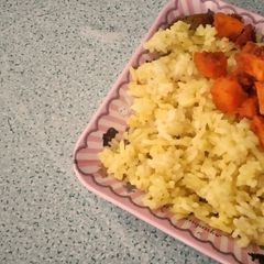 A picture of Nasi Kuning / Turmeric Rice.
